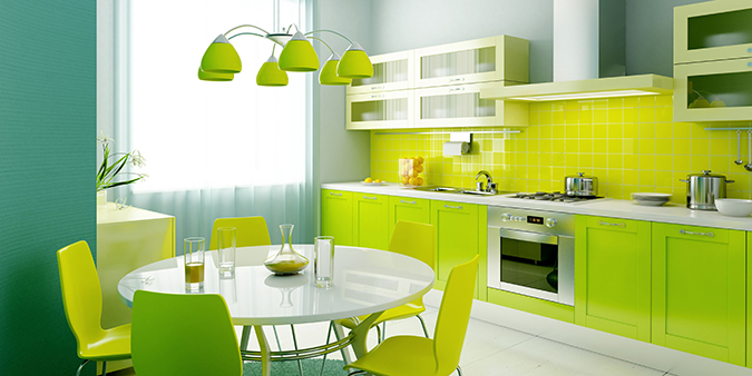 Cucina moderna verde con tavolo rotondo